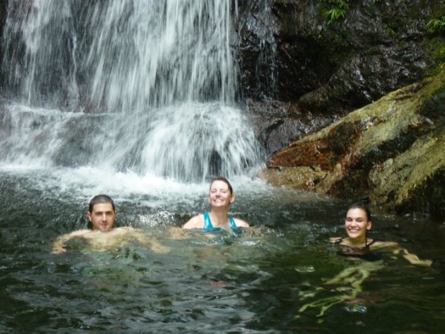 Cooling off under a waterfall in La Ceiba, Honduras