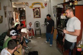 Jhonny speaks to the students inside his house. - Spotlight: Mark Denega and Voluntourism in Peru - Frayed Passport