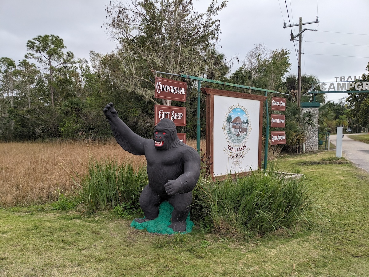 I'd Like To Introduce You To Florida's Favorite Cryptid: The Skunk Ape! - Statue and Sign - Frayed Passport