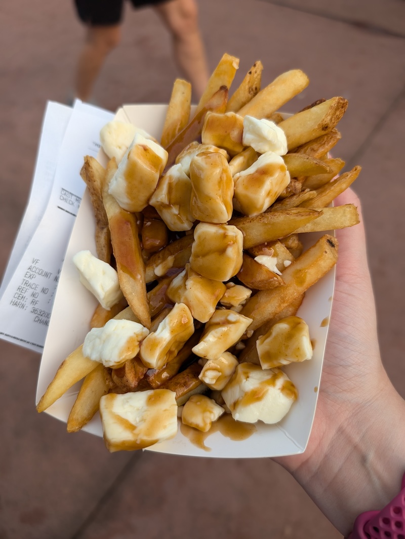 EPCOT Food & Wine Festival 2024: Pickle Milkshakes, Aloe Blacc, and Fireworks - Poutine - Frayed Passport