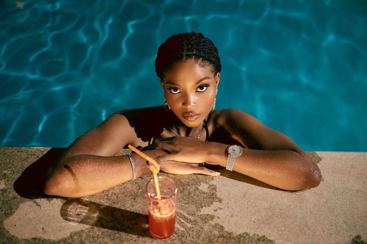 Woman in pool with drink