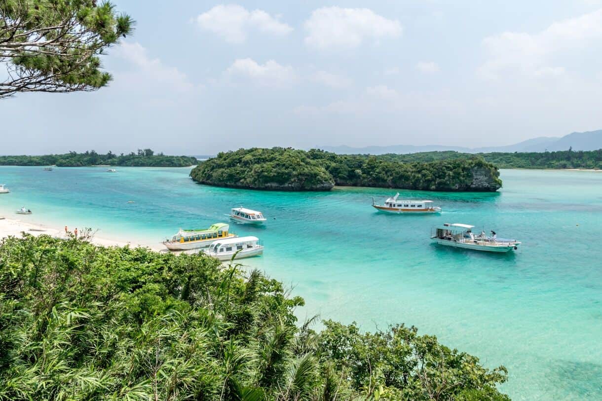Ishigaki, Japan - Frayed Passport - Calming Locations That Prove A Trip To Asia Doesn't Have To Be Hectic - white and blue boat on sea during daytime