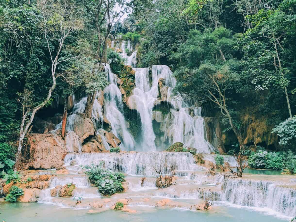 Luang Prabang, Laos - Calming Locations That Prove A Trip To Asia Doesn't Have To Be Hectic - Frayed Passport - waterfalls in the middle of the forest during daytime