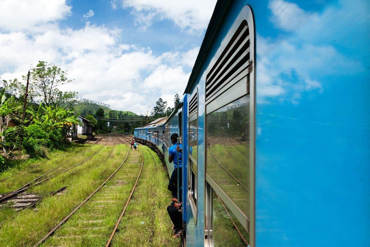 Nuwara Eliya - Calming Locations That Prove A Trip To Asia Doesn't Have To Be Hectic - Sri Lanka - Frayed Passport - blue train on rail road during daytime