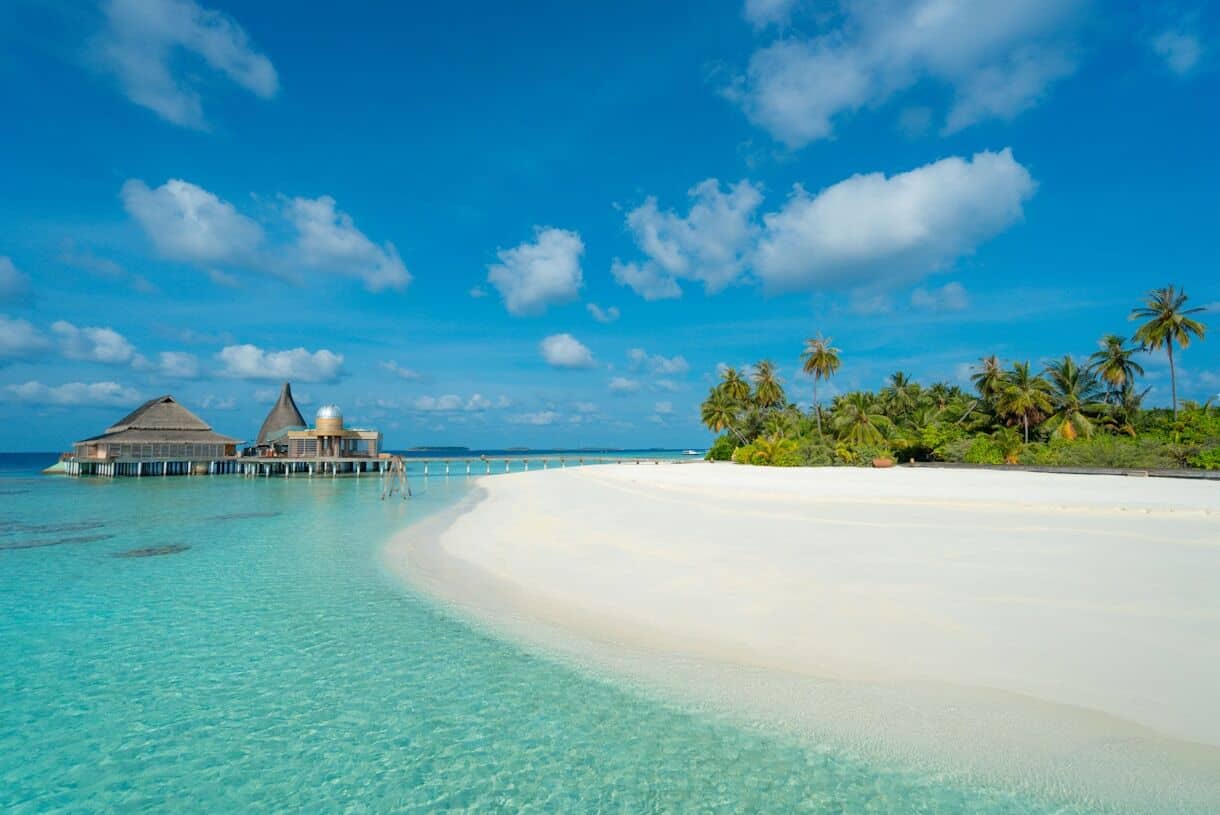 Baa Atoll, Maldives - Calming Locations That Prove A Trip To Asia Doesn't Have To Be Hectic - Frayed Passport green trees near body of water under blue sky during daytime