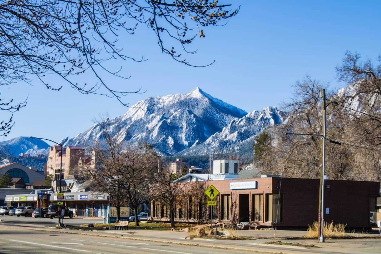 A small town with a mountain in the background