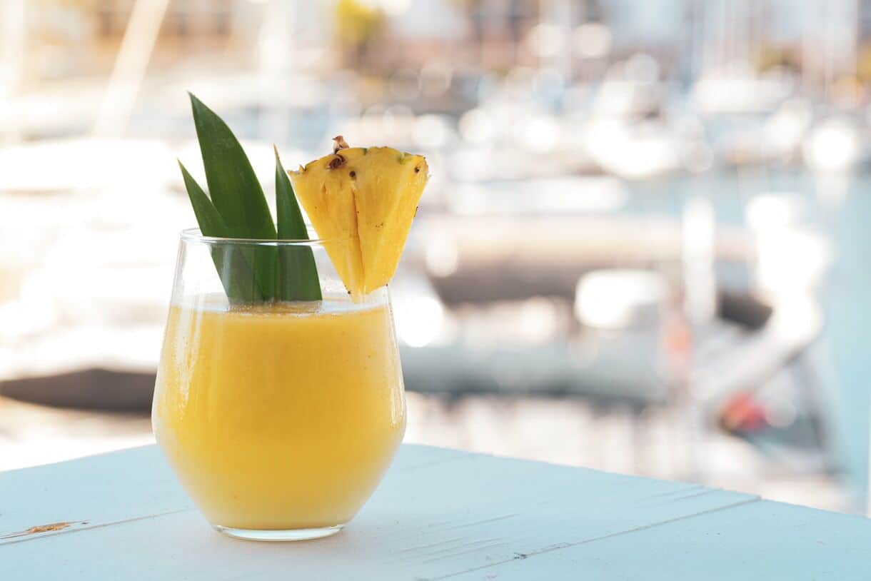 How Pineapple Mania gripped Europe for 150 years - Frayed Passport - yellow juice in clear drinking glass